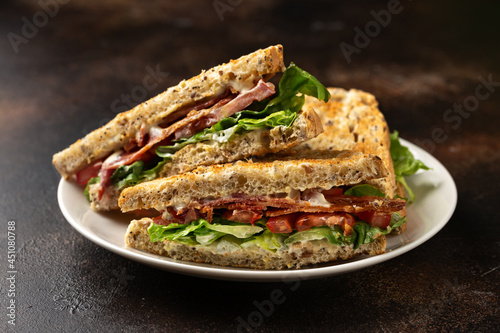 Fresh BLT Sandwiches with Bacon Lettuce and Tomato on white plate