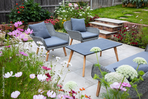Fototapeta Naklejka Na Ścianę i Meble -  Outdoor living, terrace in the garden with flowers