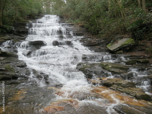 Cascading rocky waterfall in the mountains