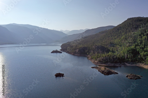 Aerial view of Lake Granby, Colorado and surrounding mountains and forests on clear calm summer morning. photo