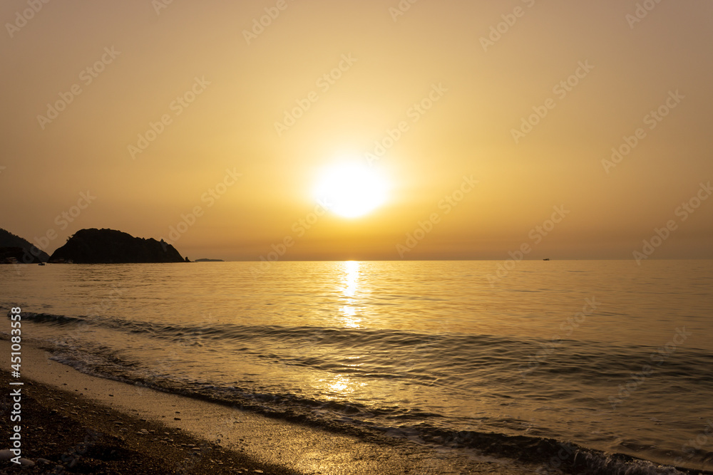 Beautiful view of seaside at dawn. Sunrise view with waves and sea. Landscape of rising sun over the sea in Cirali, Antalya, Turkey. Beautiful view of seaside at dawn. Sunrise view with waves and sea. Landscape of rising sun over the sea in Cirali, Antalya, Turkey.