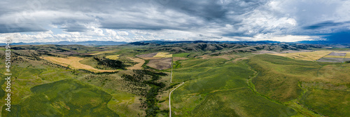 Stormy southwest Montana foothills farmland patchwork panorama - Gallatin Valley - Spanish Peaks - Rocky Mountains photo