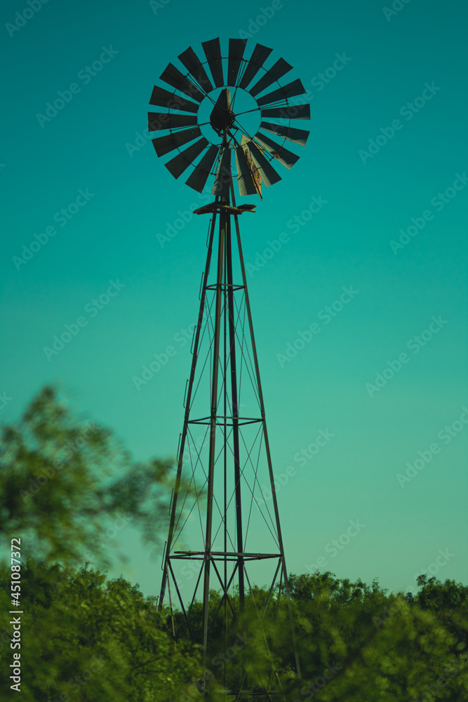 Macro still shot of a rustic windmill on an old country ranch Macro still shot of a rustic windmill on an old country ranch