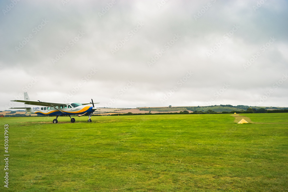 A small plane from 'GoSkydive' awaits people to land for parachute jumping A small plane from 'GoSkydive' awaits people to land for parachute jumping