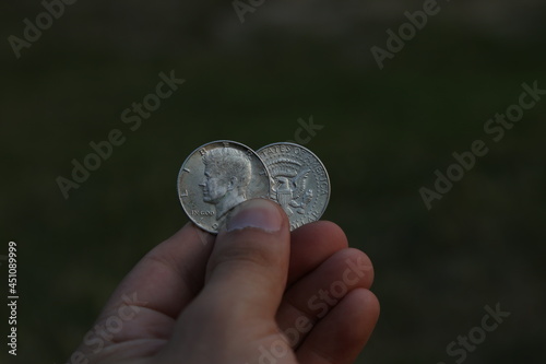 Two American coins in hand