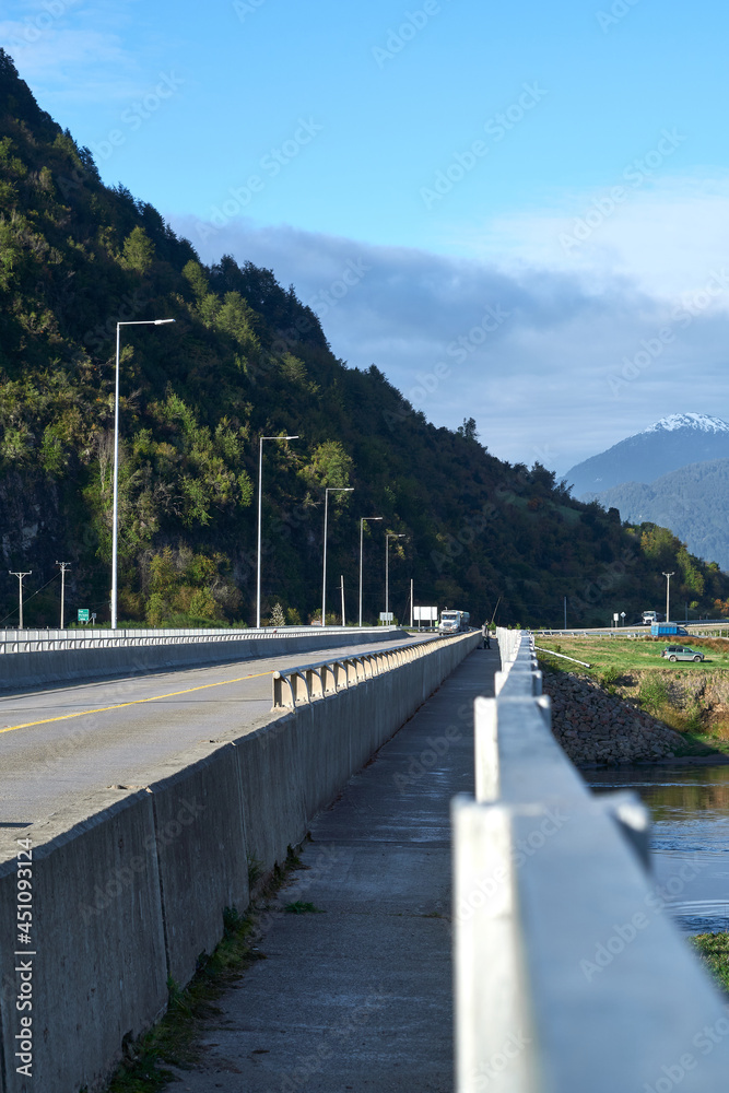 bridge transited by vehicles and people in the first hours of the day