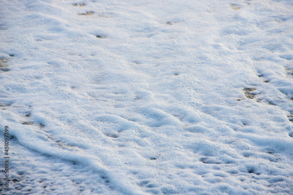 white sea foam near the shore close-up, waves white sea foam near the shore close-up, waves
