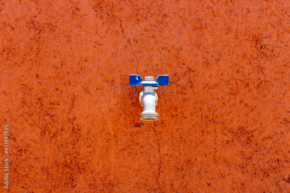water faucet on a colorful wall water faucet on a colorful wall