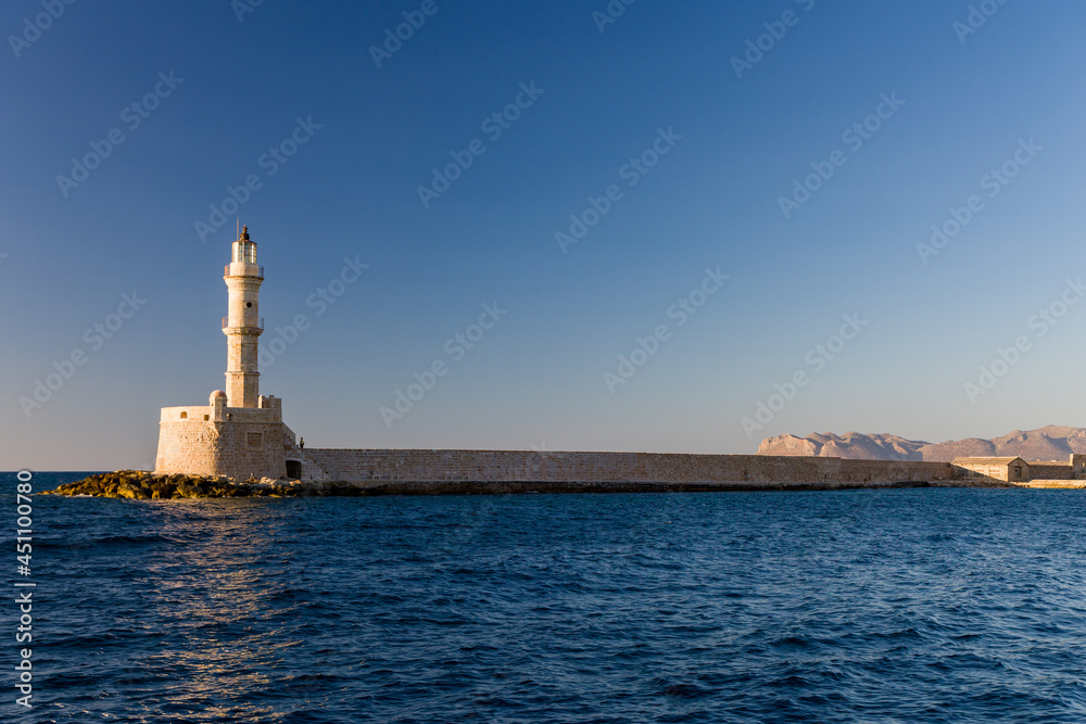 Lighthouse and old Venetian port of Chania, Crete in the late evening sun