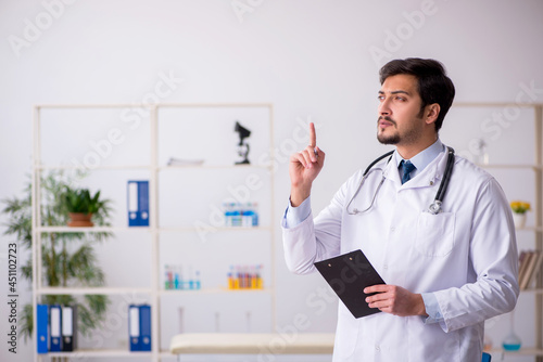 Young male doctor working in the clinic