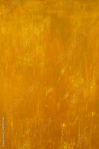 gold painted textured Abstract surface orange-gold background golden yellow highlights