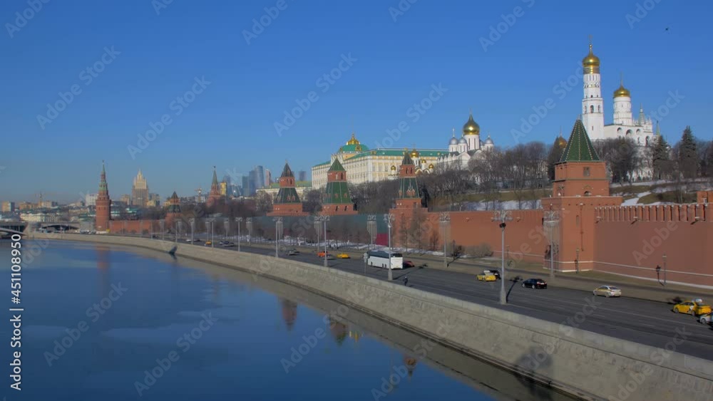 Moscow river and Kremlin in Russia, car traffic on city embankment Moscow river and Kremlin in Russia, car traffic on city embankment