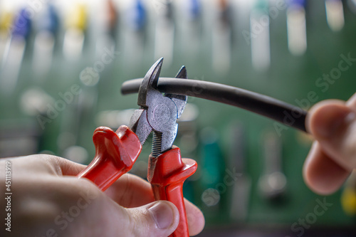 pliers cutting a heat shrink wire photo