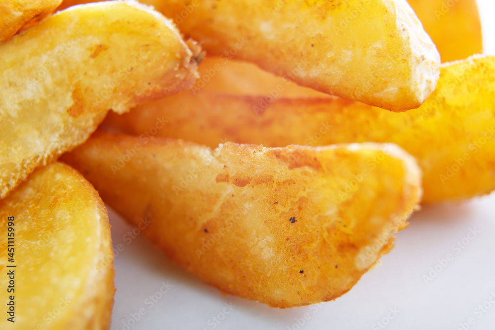 Fried potatoes close-up on a white background Fried potatoes close-up on a white background