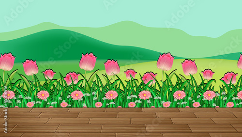 Flower field and green grass with mountain backdrop
