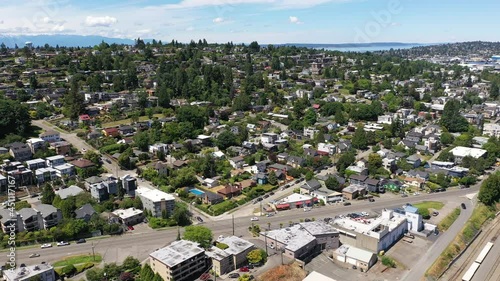 Cinematic 4K aerial drone dolly footage of Balmer Yard, Lawton Park, Southeast Magnolia, Interbay, Fremont, Adams, coastal neighborhoods uptown by Puget Sound, in Seattle, Washington photo