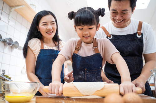 Asian happy family stay at home in kitchen  baking bakery and foods.
