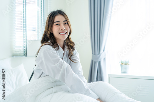 Portrait of Asian Beautiful girl in pajamas smile and look at camera. 