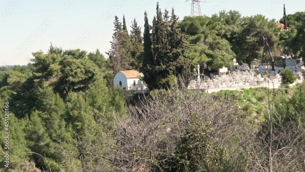 Pan shot of graveyard, located at foot of Parnitha mountain , Athens , Greece Pan shot of graveyard, located at foot of Parnitha mountain , Athens , Greece