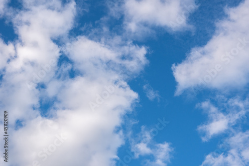 Beautiful blue panorama with fluffy cumulus clouds in the blue sky. Perfect background of blue sky and white clouds for your photos  mockup for design  use for sky replacement