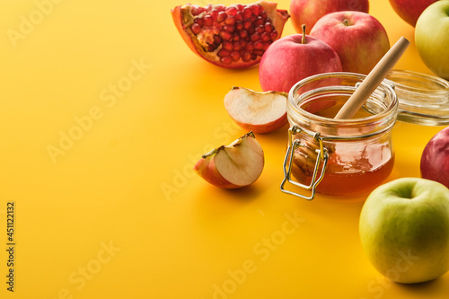 Jewish holiday Rosh Hashana design with honey and apples photo