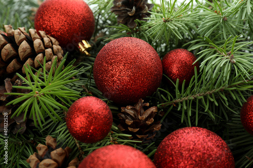 Spruce branches with cones and baubles, close up