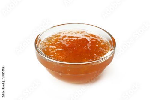 Bowl of peach jam isolated on white background
