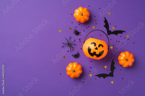Fotografie Top view photo of halloween decorations pumpkins basket spiders black sequins go