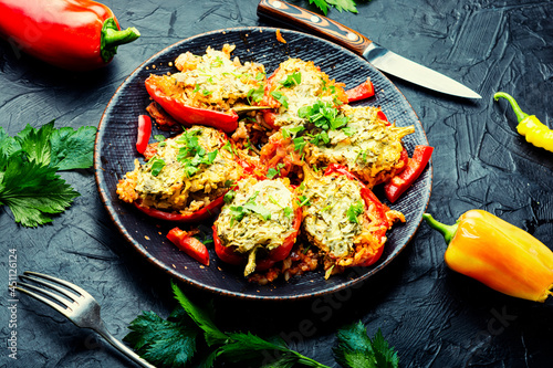 Roasted bell peppers stuffed with rice and meat photo