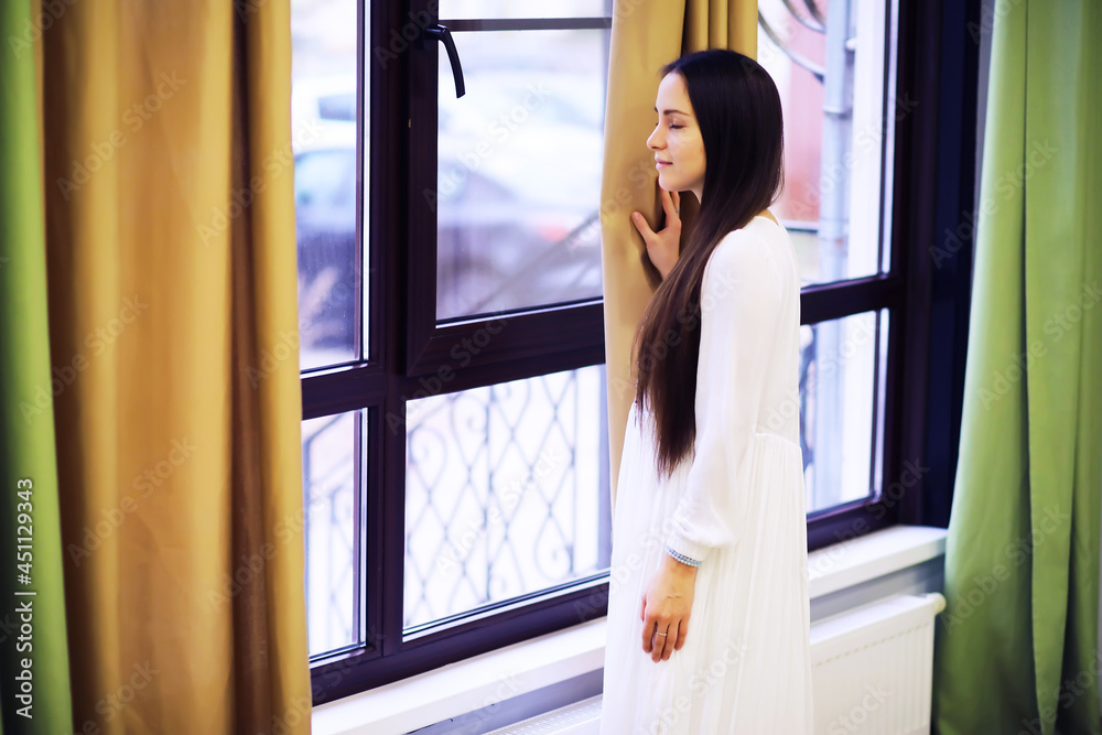 Relaxed serene pretty young woman at home, happy calm lady dream enjoy wellbeing breathing fresh air in cozy home Relaxed serene pretty young woman at home, happy calm lady dream enjoy wellbeing breathing fresh air in cozy home