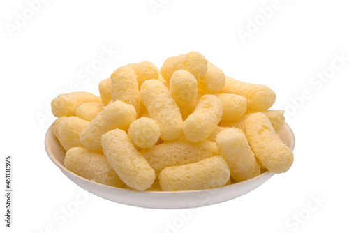 Corn puffs, finger food on a plate.