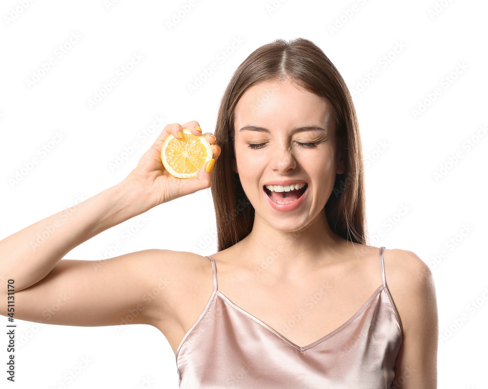 Beautiful young woman with juicy lemon on white background Beautiful young woman with juicy lemon on white background