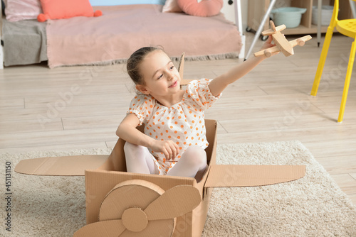Little girl playing pilot i...