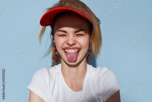 pretty woman in red cap decoration fashion blue background