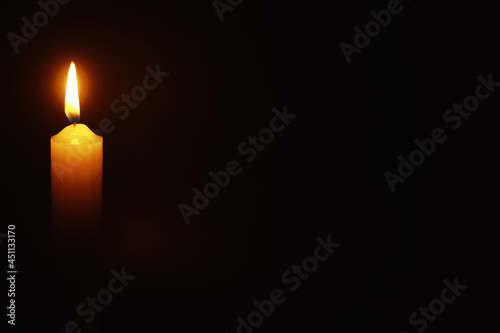Burning candle Wick from a candle in a flame of fire. Symbol of sadness and loneliness. A time of condolences. Burning wax candle. Religion. © alexkich