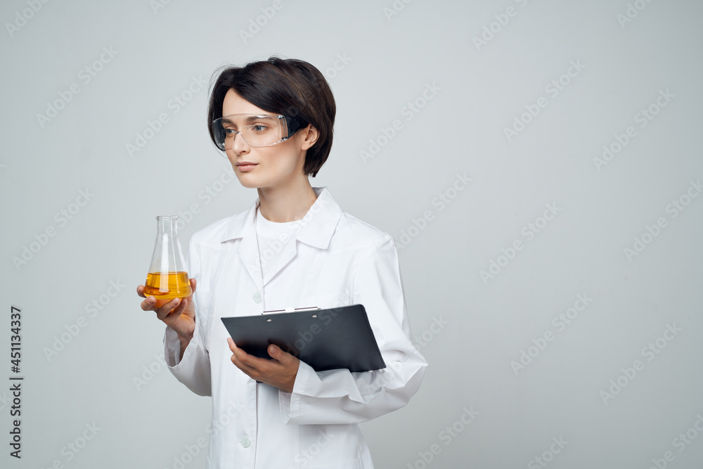 female doctor tests as part of chemistry research