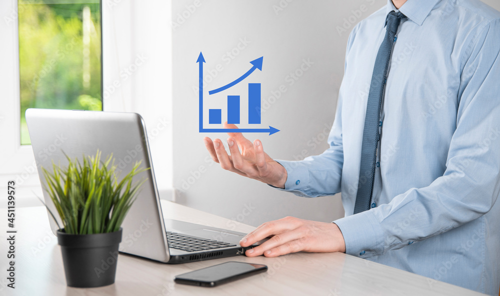 Business man holding holographic graphs and stock market statistics gain profits. Concept of growth planning and business strategy. Display of good economy form digital screen. Business man holding holographic graphs and stock market statistics gain profits. Concept of growth planning and business strategy. Display of good economy form digital screen.