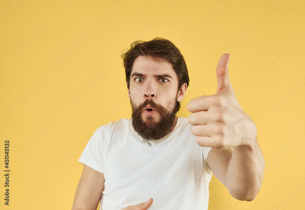 bearded man in white t-shirt cropped view yellow background bearded man in white t-shirt cropped view yellow background
