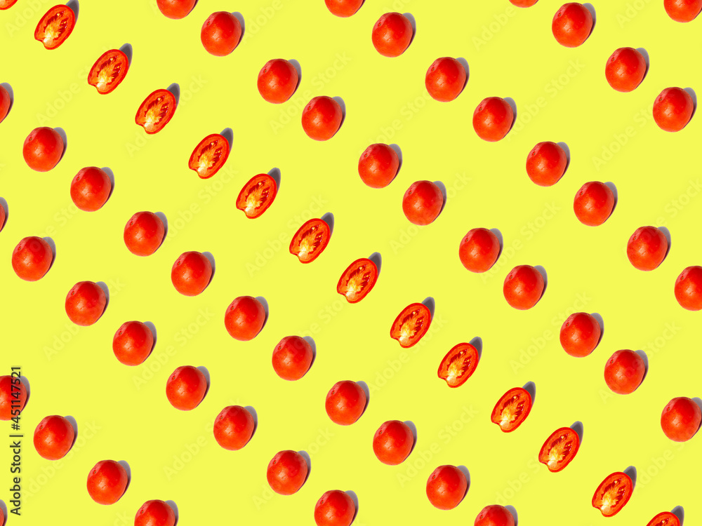 Image of tomatoes on a yellow background. View from above. Image of tomatoes on a yellow background. View from above.