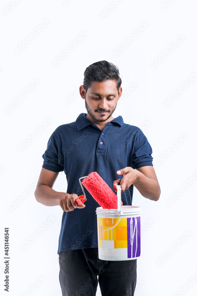 Young indian Painter man over white background. Young indian Painter man over white background.