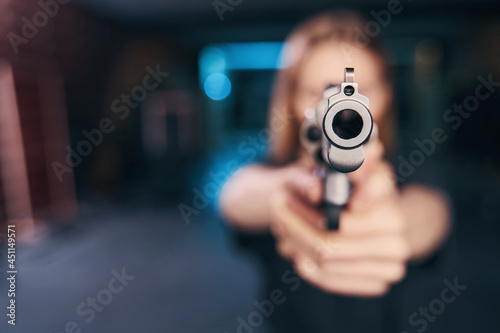 Woman sniper practicing a two-handed hold during the training exercise