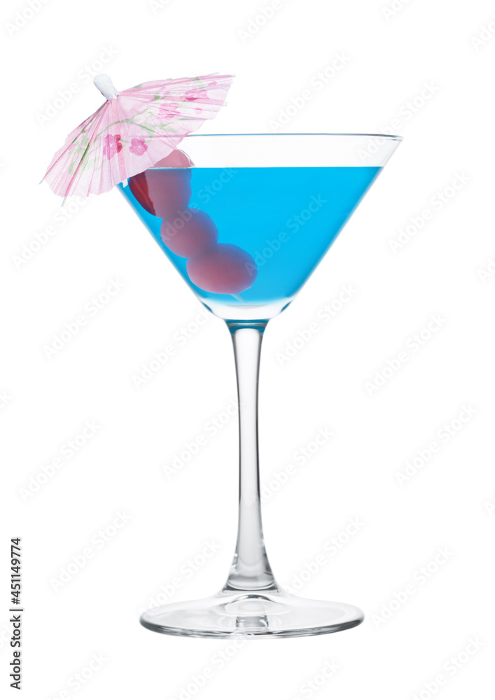 Blue lagoon cocktail in martini glass with sweet cherry and umbrella on white. Blue lagoon cocktail in martini glass with sweet cherry and umbrella on white.