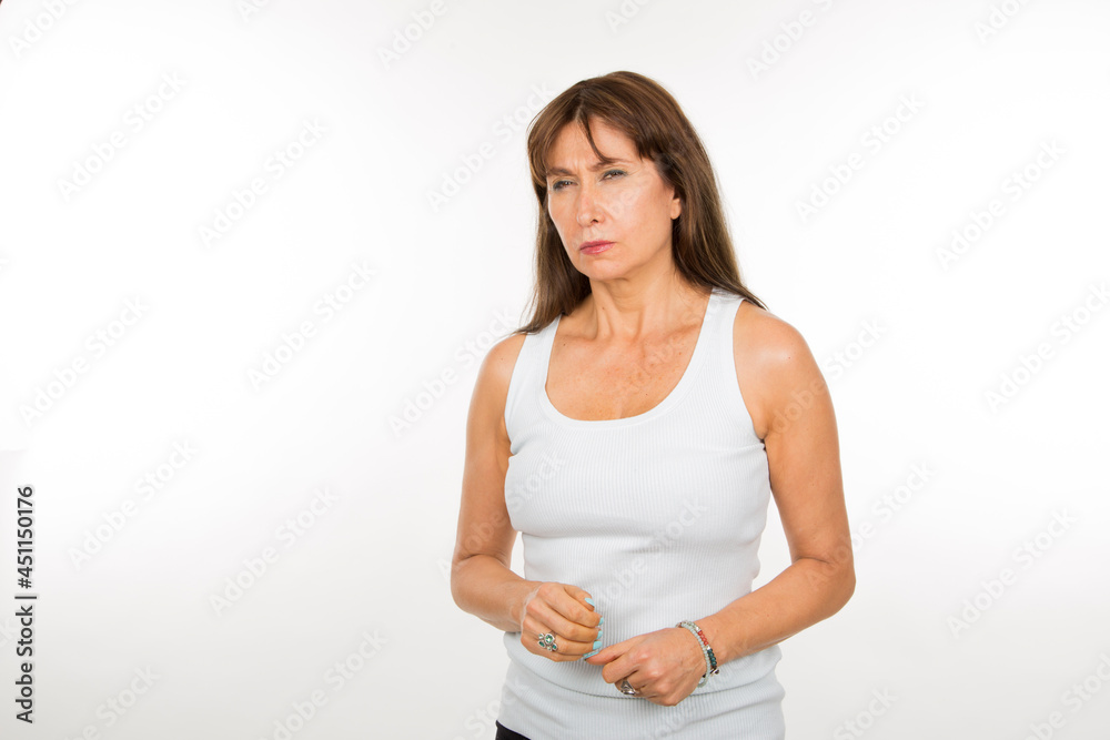 Doubtful senior white woman on white background Doubtful senior white woman on white background