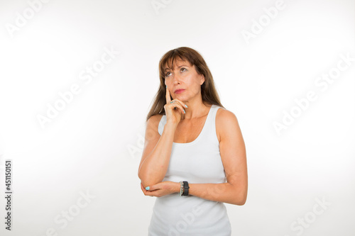 thoughtful senior white woman on white background © luisrojasstock