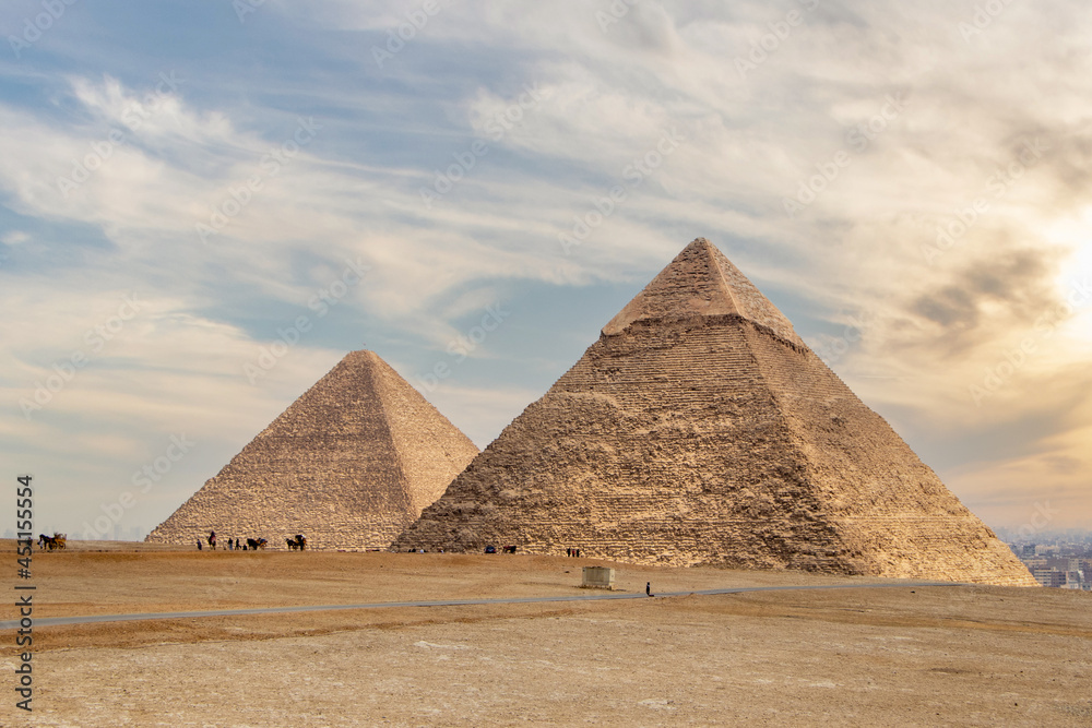 The Pyramid of Khufu and the Pyramid of Khafre with dramatic sky in Egypt The Pyramid of Khufu and the Pyramid of Khafre with dramatic sky in Egypt