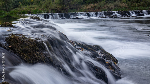 Scenic shot of an epic natural river called Dobra in Croatia, surrounded by a forest photo