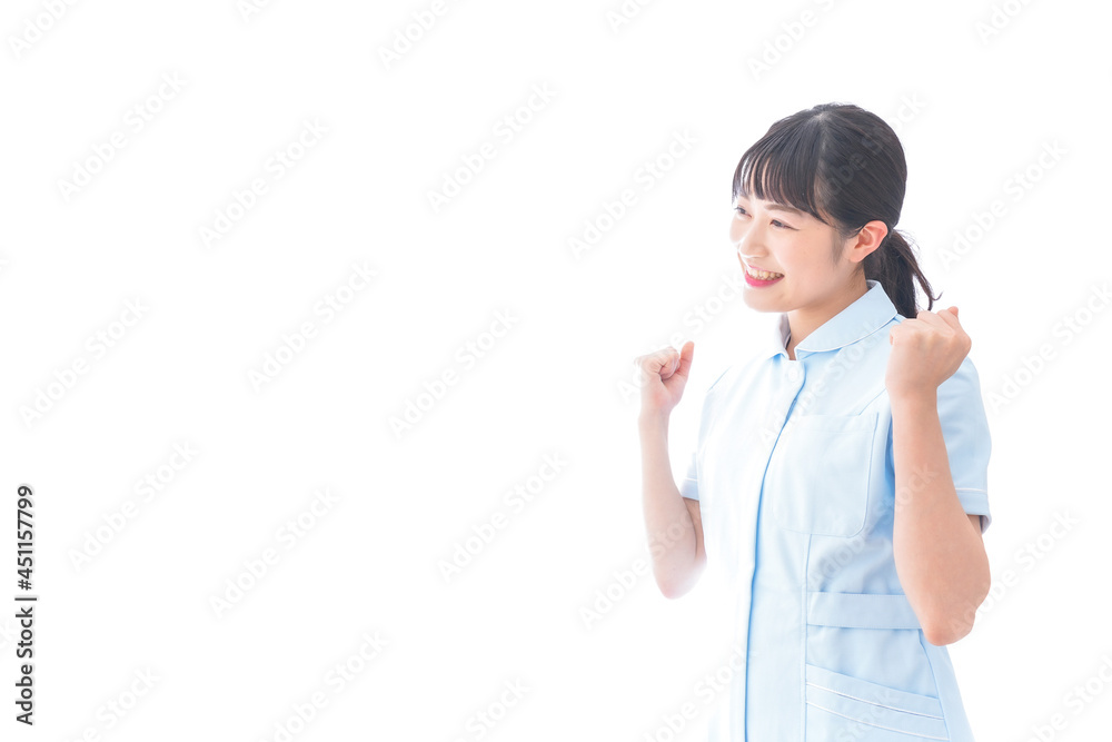 ガッツポーズをする若い看護師 ガッツポーズをする若い看護師