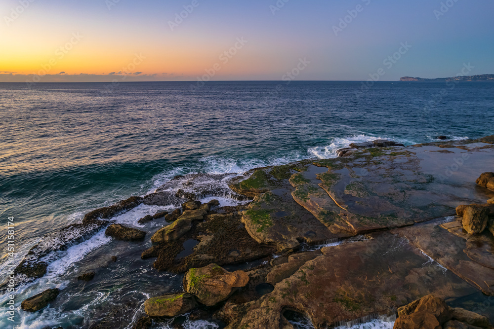 Aerial sunrise over the sea with clear skies Aerial sunrise over the sea with clear skies
