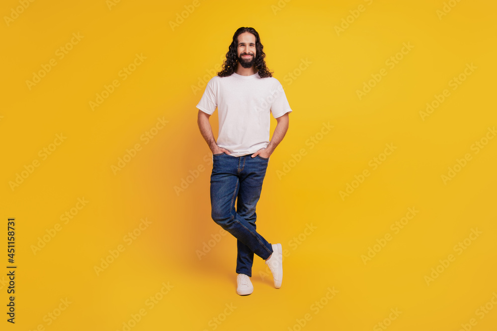 Portrait of businessman guy hands pockets look camera wear casual clothes on yellow background