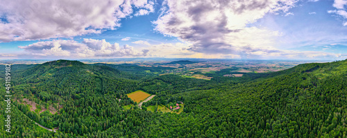 Aerial view of agricultural and green fields in countryside. Nature landscape in summer day, panorama